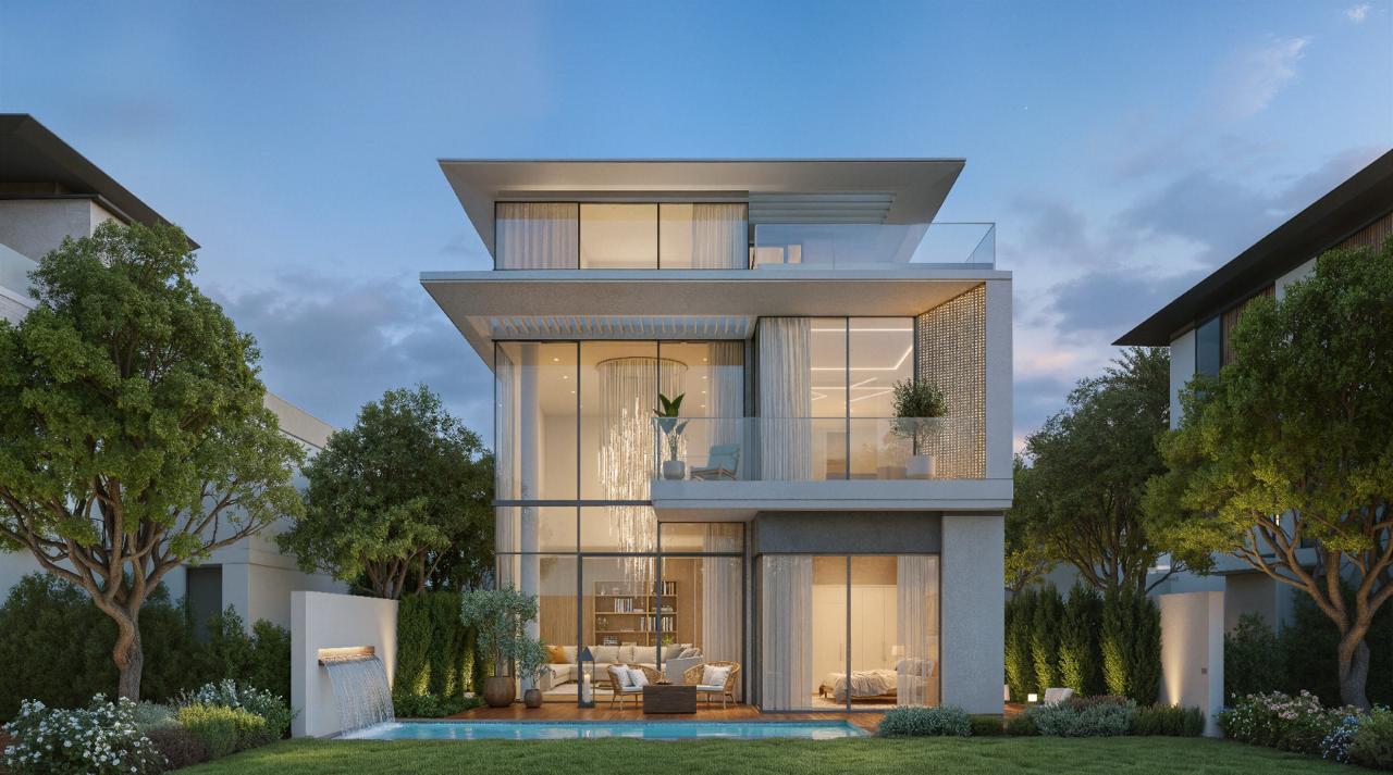 Azizi Florence Sharjah &mdash; a villa pool terrace and water feature at dusk
